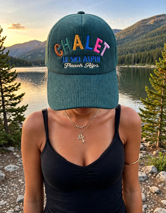 Chalet Le Ski Alpin Corduroy Trucker Hat - Teal on the hat model at Payette Lake