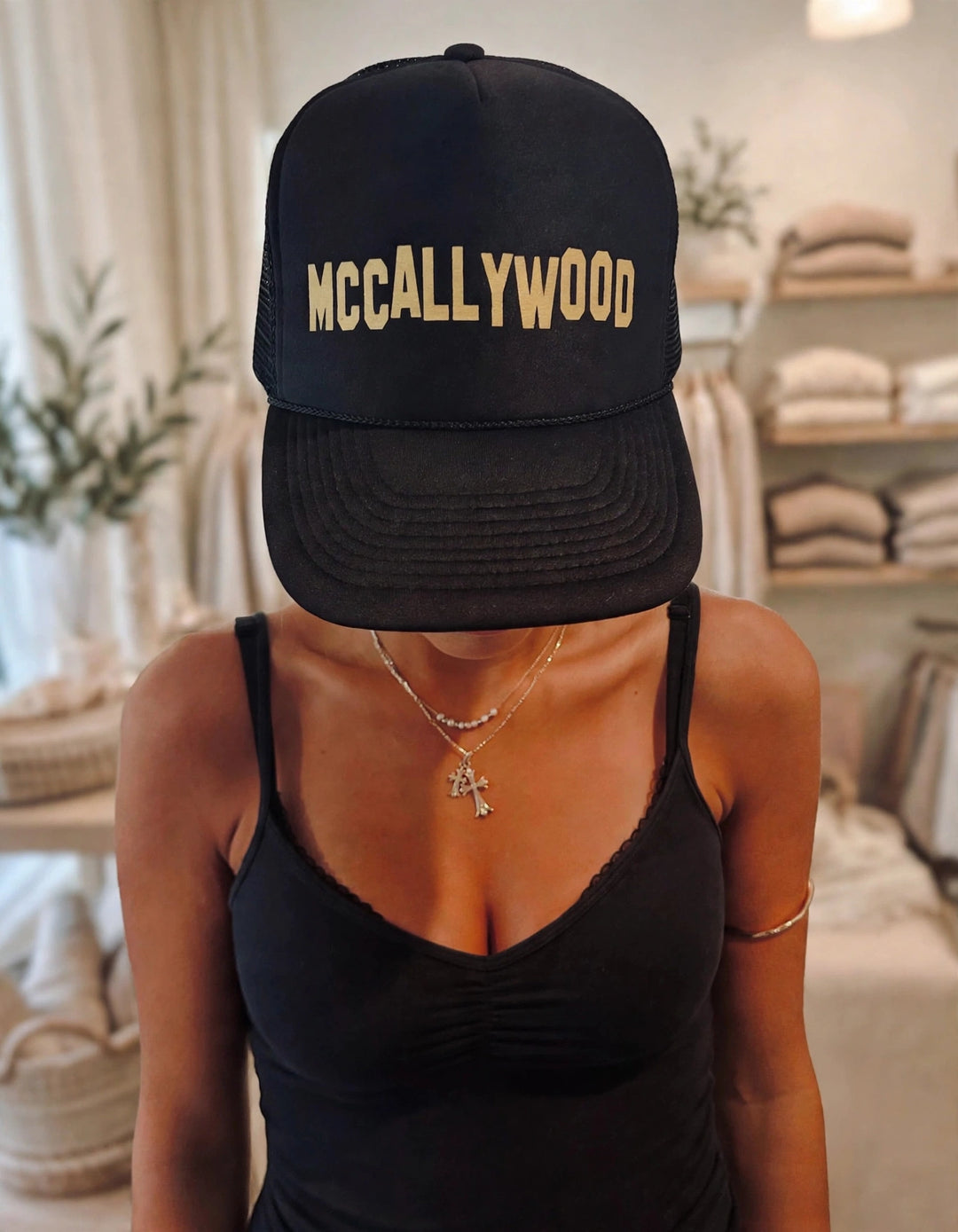 McCallyWood trucker hat - Black and Gold studio view