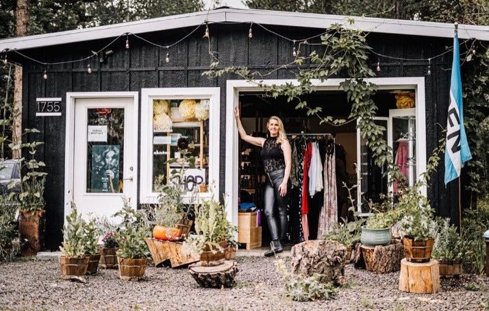 Clare at the door of TopSide Boutique in McCall, Idaho